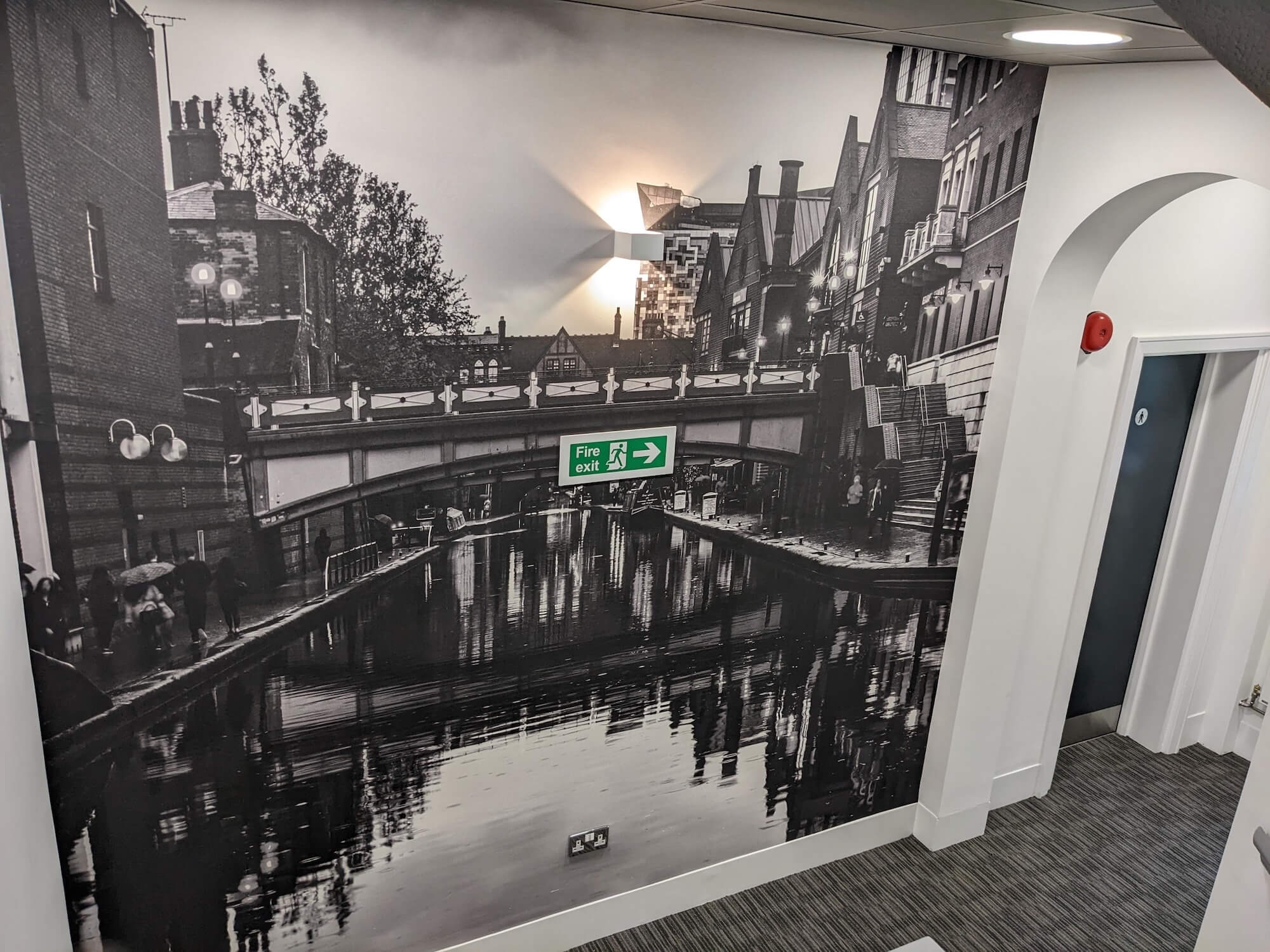 Black and white city canal stairwell mural