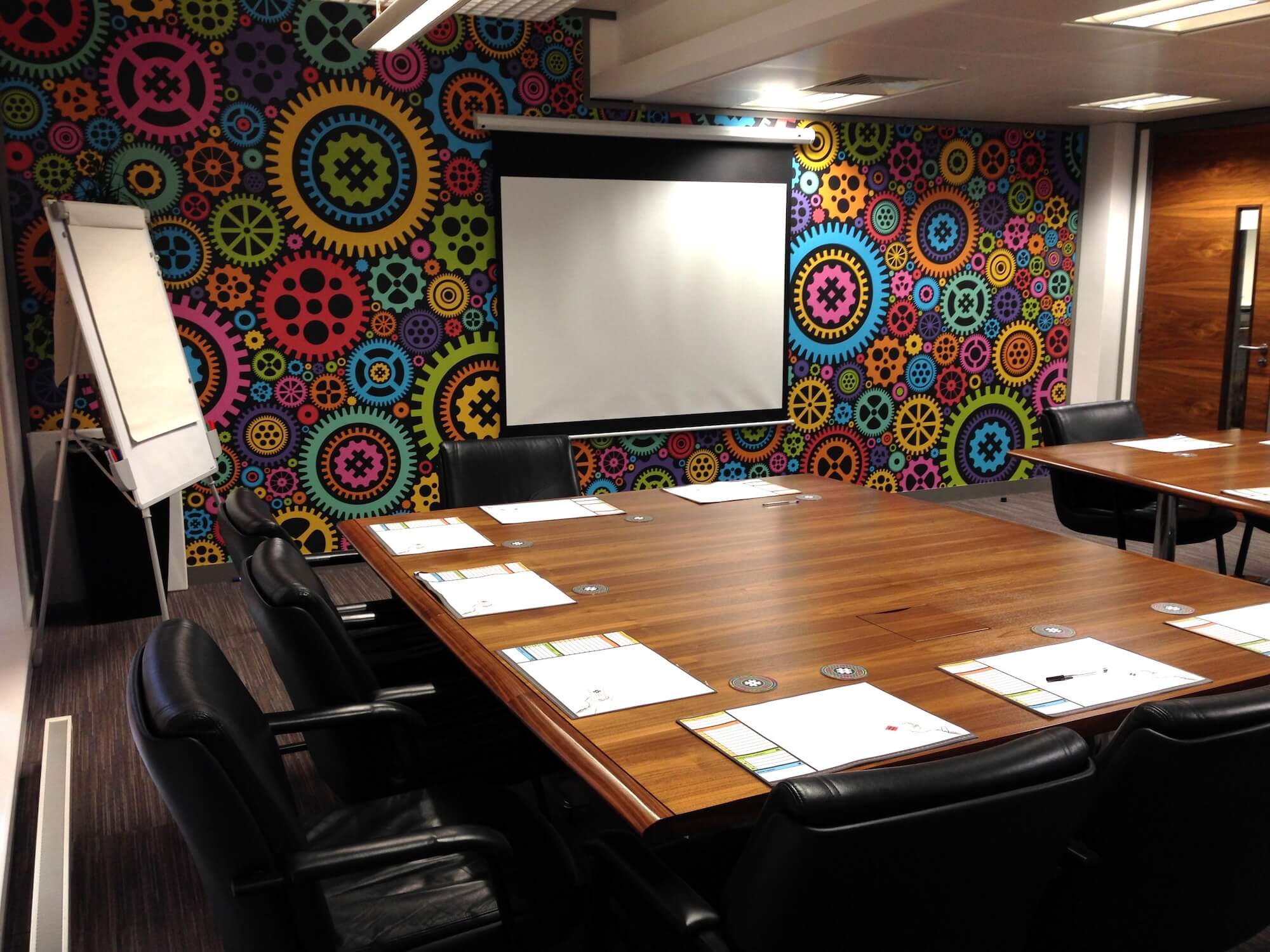 Colourful cogs and gears pattern boardroom wall mural